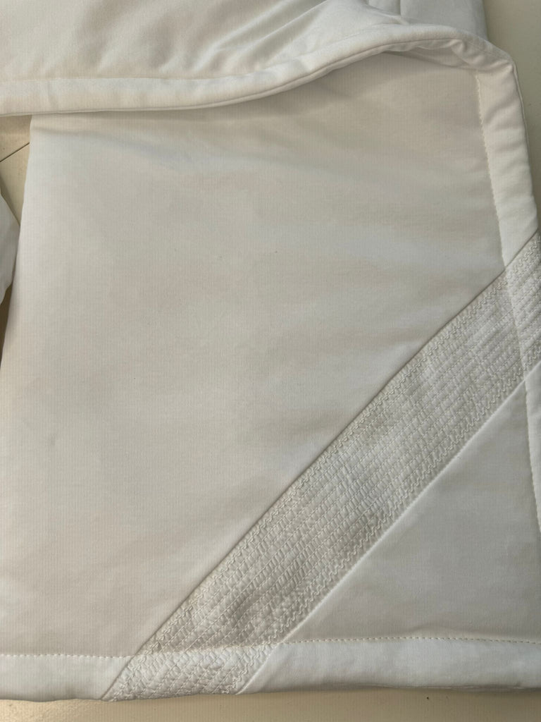 White smocked blanket